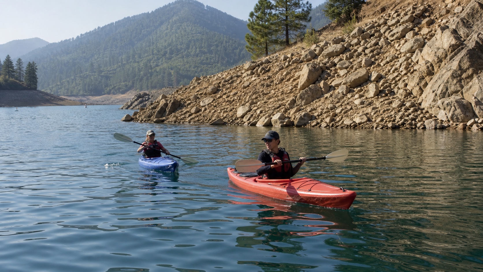 Kayakers in a secluded Lake Shasta cove