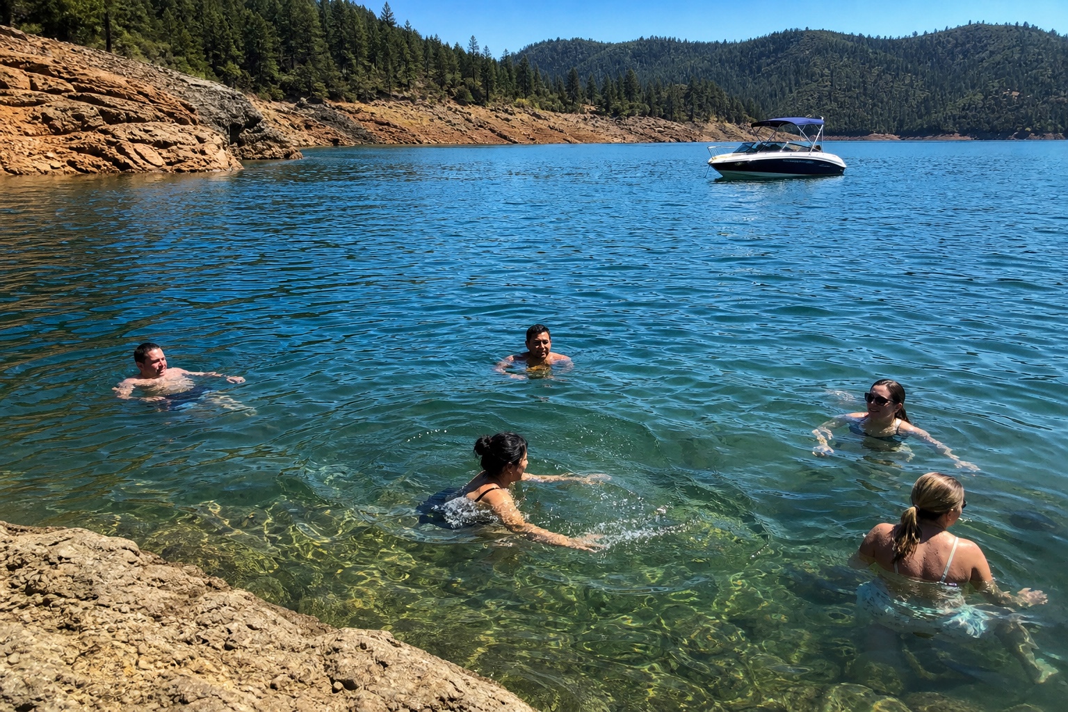 Family swimming near a Lake Shasta cove